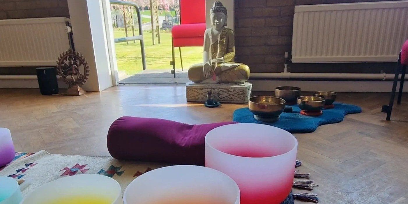 Meditation room with Buddha and singing bowls.